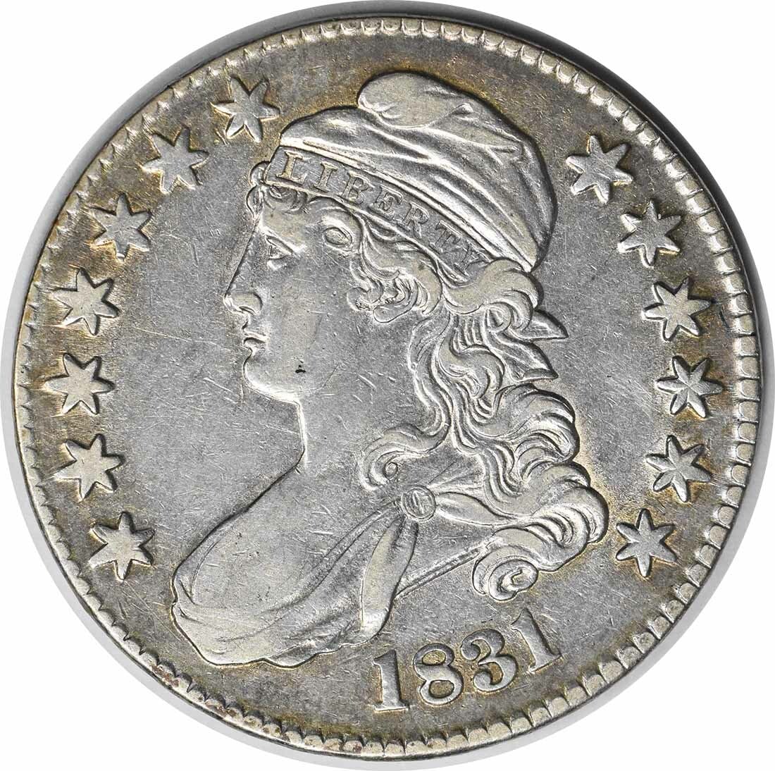1831 Philadelphia Capped Bust 50C Silver Half Dollar XF Uncertified: 1831 Philadelphia Capped Bust 50C Silver Half Dollar XF Uncertified This 1831 Bust Half Dollar from the United States is a circulated coin featuring the design by John Reich. Struck at the Philadelphi