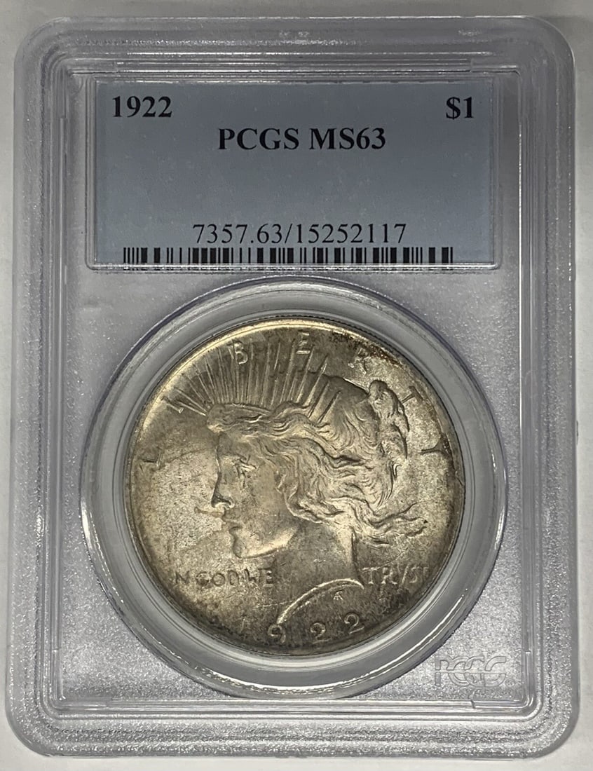 1922 Peace Dollar Silver Coin PCGS MS 63 Light Toning: 1922 Peace Dollar Silver Coin PCGS MS 63 Light Toning This 1922 Peace Silver Dollar is a lightly toned coin certified by PCGS with a grade of MS 63. It is uncirculated and composed of silver, featurin