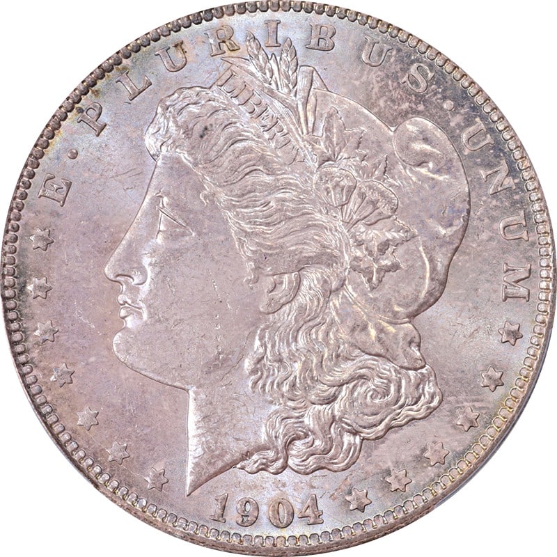 1904-O Morgan Silver Dollar PCGS MS65 Uncirculated with Beautiful Toning: 1904-O Morgan Silver Dollar PCGS MS65 Uncirculated with Beautiful Toning This stunning 1904-O Morgan Silver Dollar showcases exceptional eye appeal, featuring fantastic luster and a strong strike. Bot