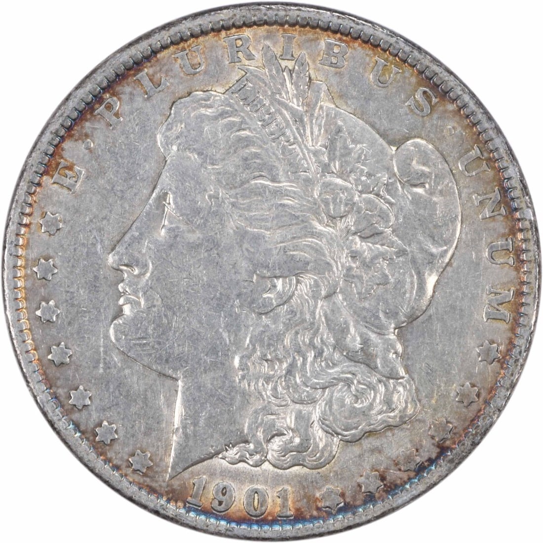 1901 Morgan Silver Dollar Uncertified by George T Morgan: 1901 Morgan Silver Dollar Uncertified by George T Morgan This 1901 Morgan Silver Dollar is an exquisite piece of numismatic history, showcasing the artistry of designer George T. Morgan. The coin is c