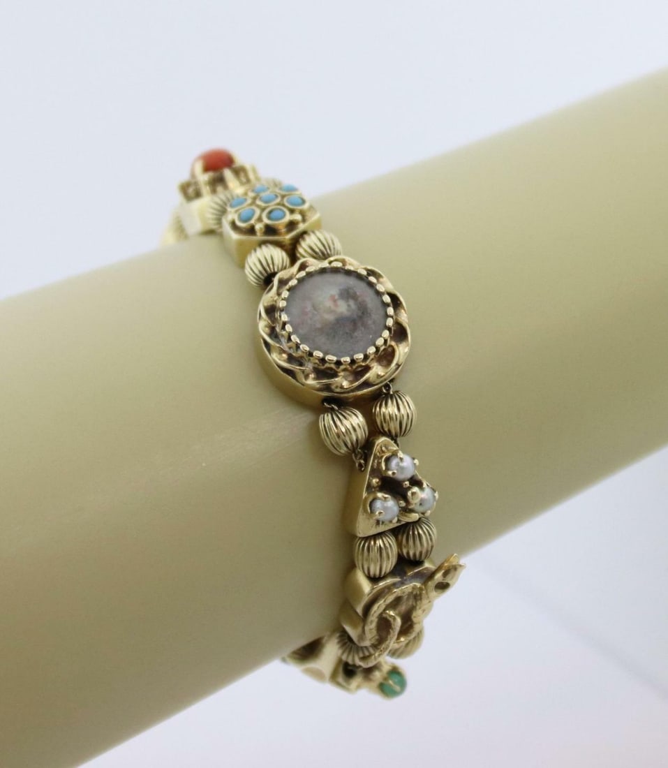 Vintage 14k Yellow Gold Charm Bracelet with 10 Multi-Color Gemstones: Vintage 14k Yellow Gold Charm Bracelet with 10 Multi-Color Gemstones Discover this exquisite vintage slide charm bracelet, meticulously crafted from 14k yellow gold. This charming piece features 10 as
