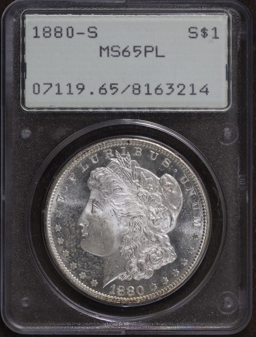 PCGS MS65 Proof-Like Morgan Dollar 1880 San Francisco Silver Rattler Holder: PCGS MS65 Proof-Like Morgan Dollar 1880 San Francisco Silver Rattler Holder This is a 1880-S Morgan Silver Dollar graded MS65 Proof-Like by PCGS. The coin is uncirculated and features a silver composi