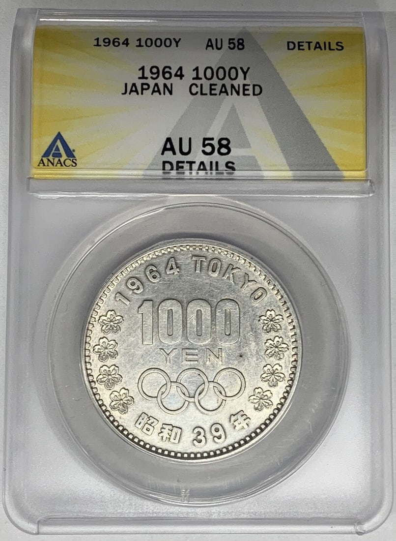 Japan 1964 1000 Yen ANACS Certified AU 58 Coin Cleaned: Japan 1964 1000 Yen ANACS Certified AU 58 Coin Cleaned This is a 1964 Japan 1000 Yen coin certified by ANACS with a grade of AU 58. The coin has been noted as cleaned and is in pre-owned condition. It