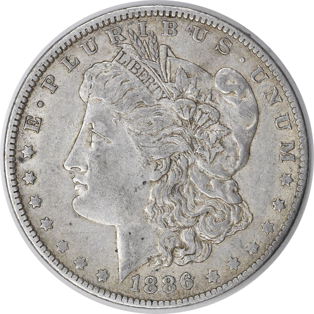 1886-O Morgan Silver Dollar XF Uncertified New Orleans Coin: 1886-O Morgan Silver Dollar XF Uncertified New Orleans Coin This 1886-O Morgan Silver Dollar, a cherished piece of numismatic history, features a rich silver composition of 90% silver and 10% copper. 