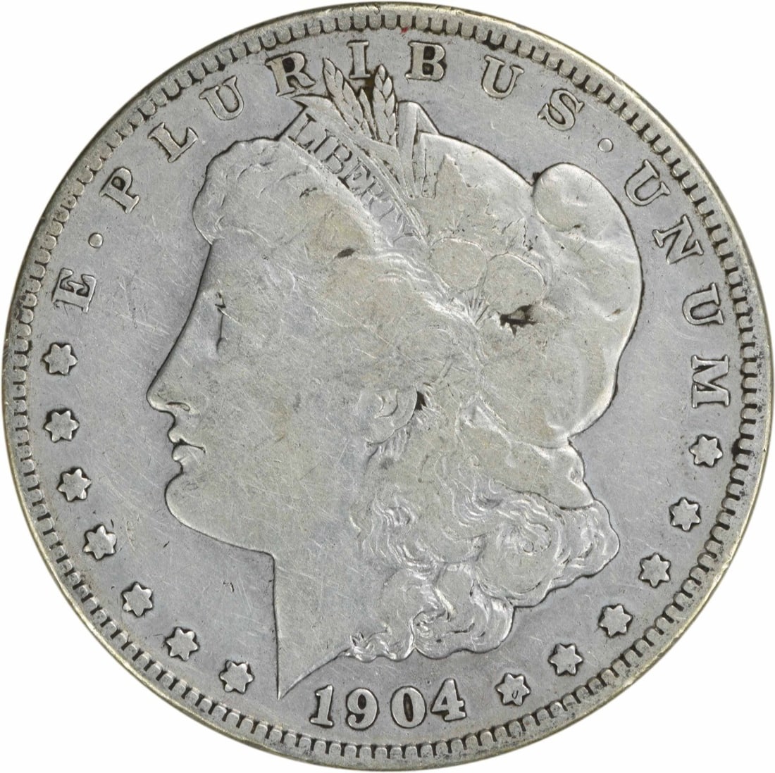 1904-S Morgan Silver Dollar VG Uncertified Coin by George T. Morgan: 1904-S Morgan Silver Dollar VG Uncertified Coin by George T. Morgan This 1904-S Morgan Silver Dollar is a classic piece of numismatic history. Circulated and graded as Very Good (VG), this coin featur