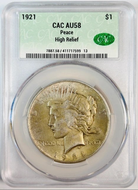 1921 Silver Peace Dollar High Relief AU 58 CACG CAC Certified: 1921 Silver Peace Dollar High Relief AU 58 CACG CAC Certified This is a 1921 Peace Dollar featuring a high relief design. The coin is composed of silver and is graded AU 58 by CACG, with CAC certifica