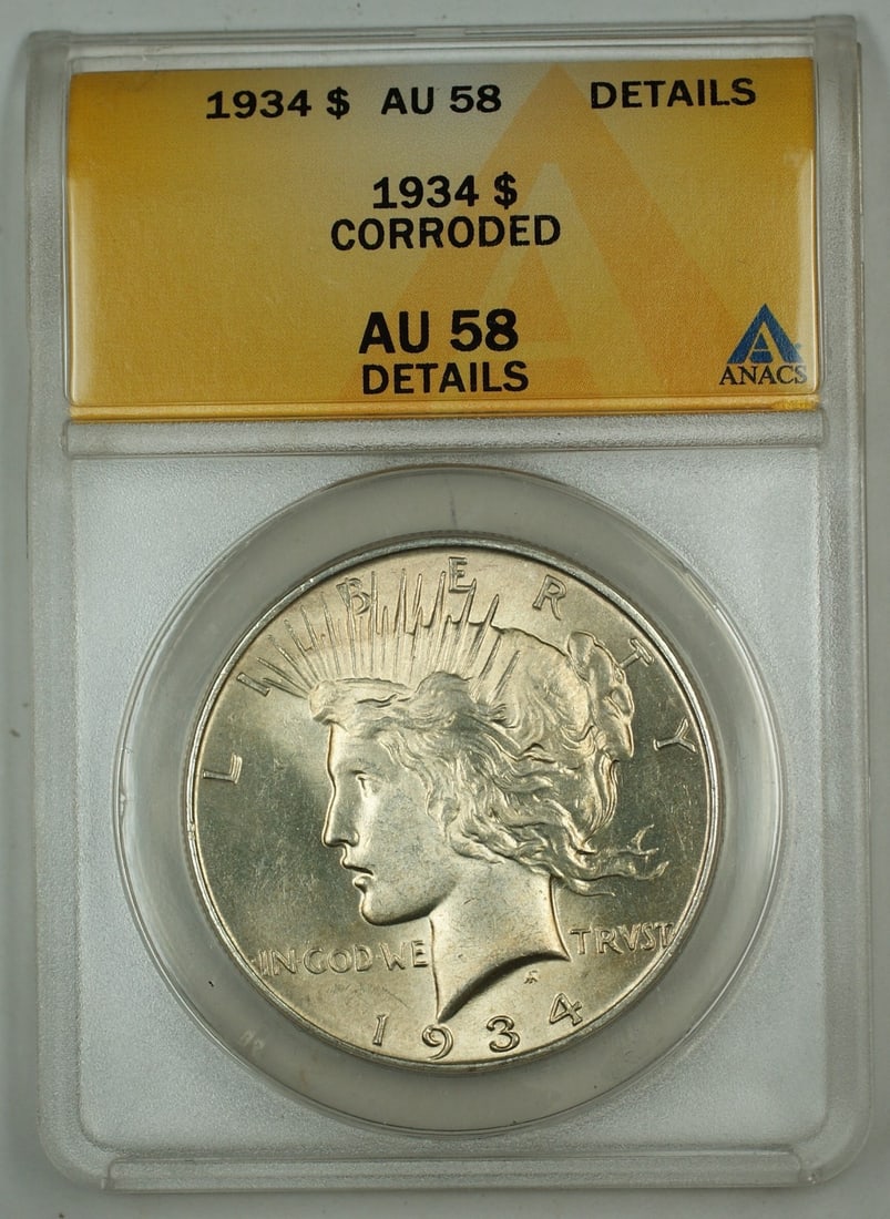 1934 Peace Dollar Silver $1 Coin ANACS AU-58 Details Corroded Philadelphia Mint: 1934 Peace Dollar Silver $1 Coin ANACS AU-58 Details Corroded Philadelphia Mint This is a 1934 Silver Peace Dollar coin graded AU-58 Details by ANACS, indicating it is uncirculated but has been noted 