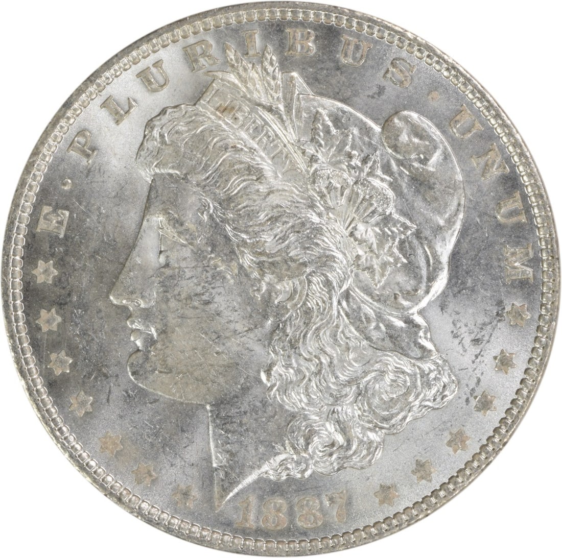 Uncirculated 1887 Silver Morgan Dollar Brilliant Uncertified No Mint Mark: Uncirculated 1887 Silver Morgan Dollar Brilliant Uncertified No Mint Mark This 1887 Morgan Silver Dollar is an uncirculated coin featuring brilliant uncirculated (BU) grade. It is composed of silver, 