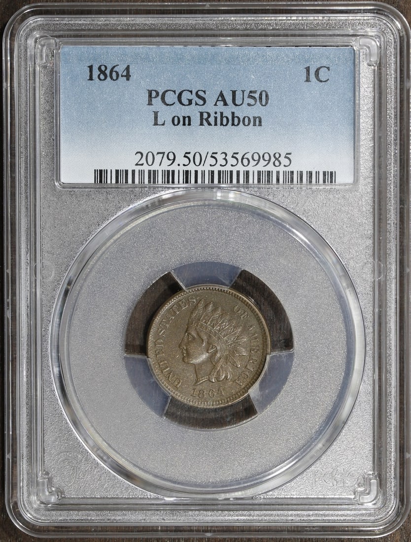 Indian Head Cent 1864 L on Ribbon PCGS AU50 Brown Copper Coin: Indian Head Cent 1864 L on Ribbon PCGS AU50 Brown Copper Coin This 1864 Indian Head Cent features the desirable 'L on Ribbon' variety and has been graded AU 50 by PCGS. Struck in Philadelphia, this pr