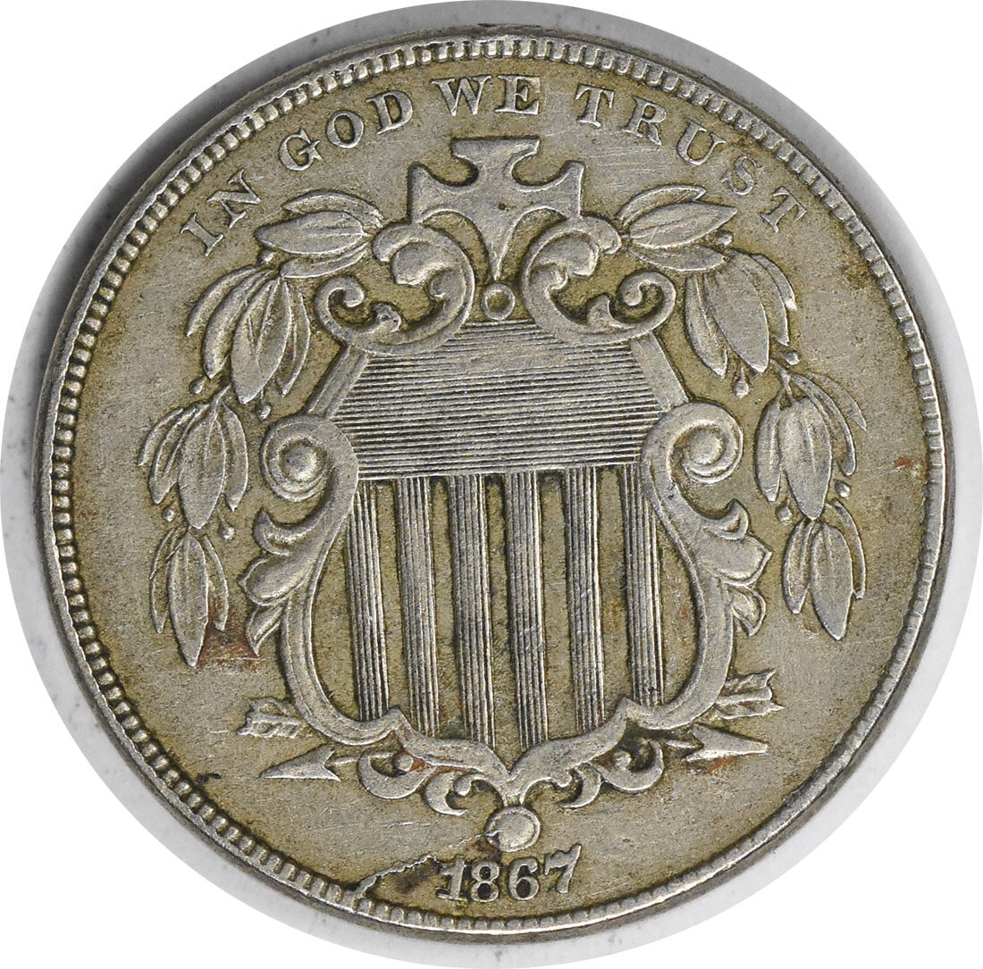 1867 United States Shield Nickel No Rays RPD Uncertified XF Grade: 1867 United States Shield Nickel No Rays RPD Uncertified XF Grade This 1867 Shield Nickel features the 'No Rays' design with a repunched date (RPD). Struck at the Philadelphia Mint, this circulated co