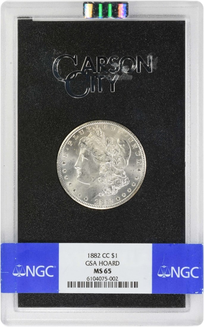 NGC MS65 GSA Carson City 1882 Morgan Dollar Silver Coin: NGC MS65 GSA Carson City 1882 Morgan Dollar Silver Coin This 1882-CC Morgan Silver Dollar is certified MS65 by NGC and is presented in a GSA holder. Struck at the Carson City Mint, it features a compo