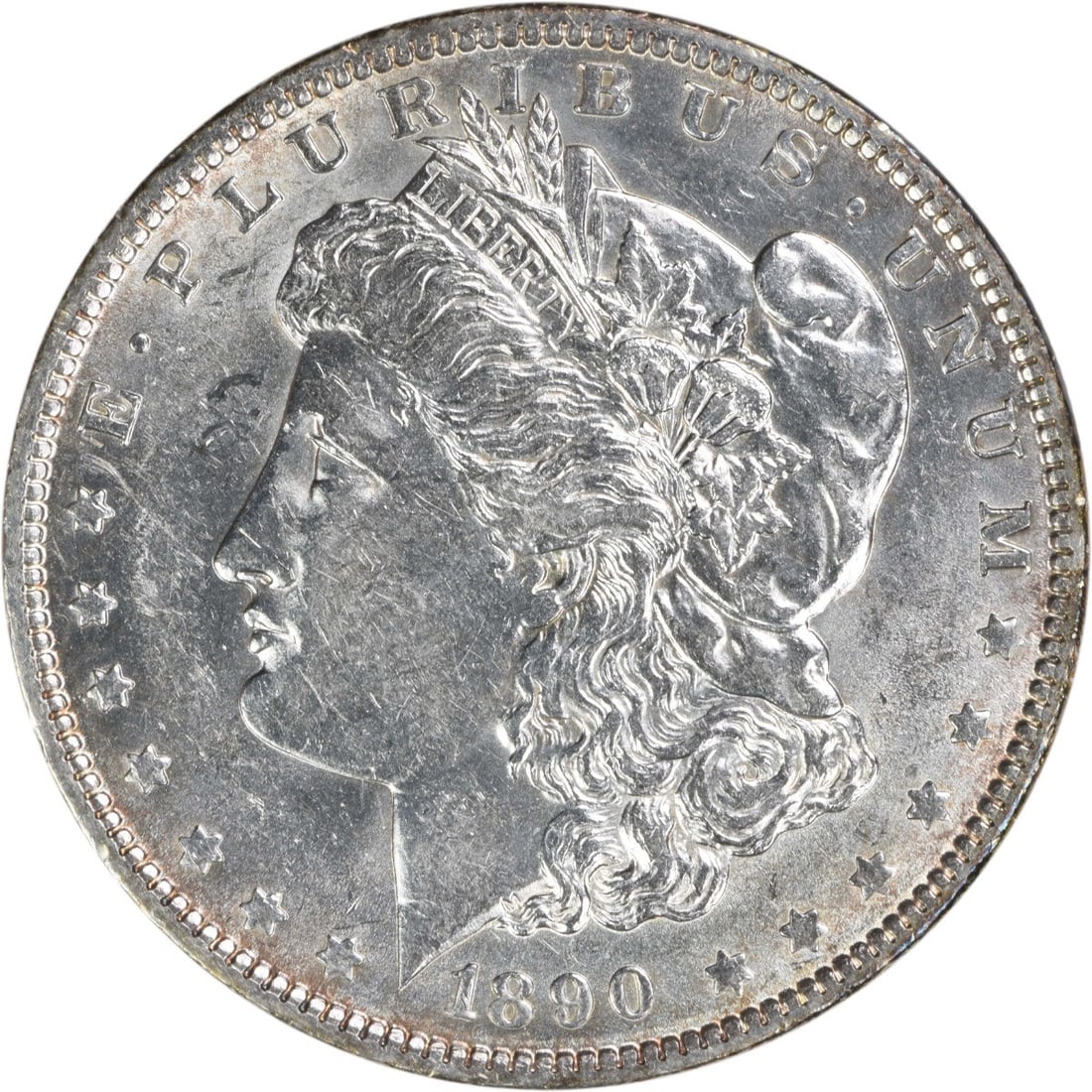 1890 AU Grade Morgan Dollar 90 Percent Silver Uncertified: 1890 AU Grade Morgan Dollar 90 Percent Silver Uncertified This 1890 Morgan Silver Dollar is an uncertified, circulated coin from the United States, minted in Philadelphia. Composed of 90% silver and 1