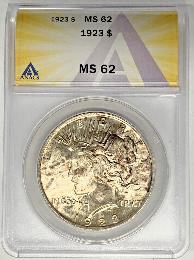 1923 Peace Dollar Silver Coin ANACS MS 62 Toned Uncirculated: 1923 Peace Dollar Silver Coin ANACS MS 62 Toned Uncirculated This is a 1923 Peace Silver Dollar coin from the United States, featuring a toned finish. The coin is uncirculated and has been certified b