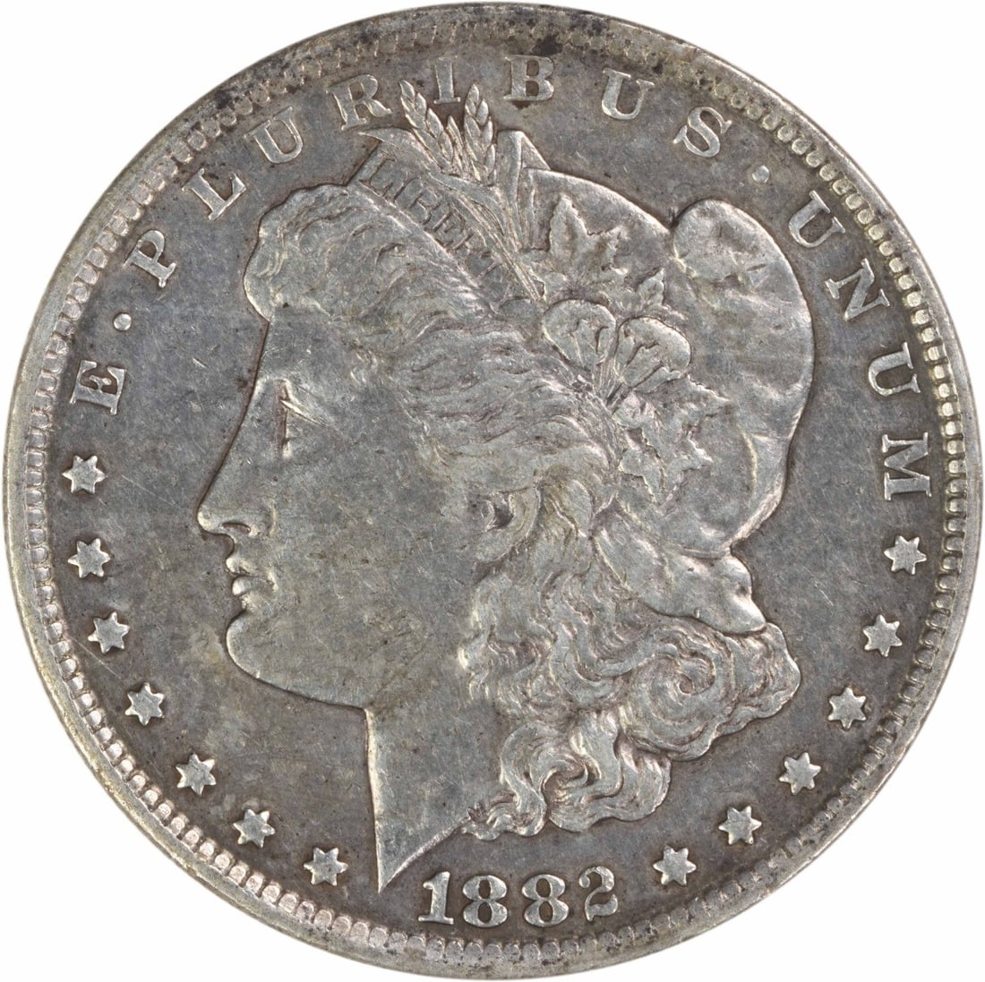 Carson City 1882 Morgan Dollar 90 Percent Silver EF Uncertified: Carson City 1882 Morgan Dollar 90 Percent Silver EF Uncertified This 1882-CC Morgan Silver Dollar is an example of the classic U.S. coin designed by George T. Morgan. Struck at the Carson City Mint, t