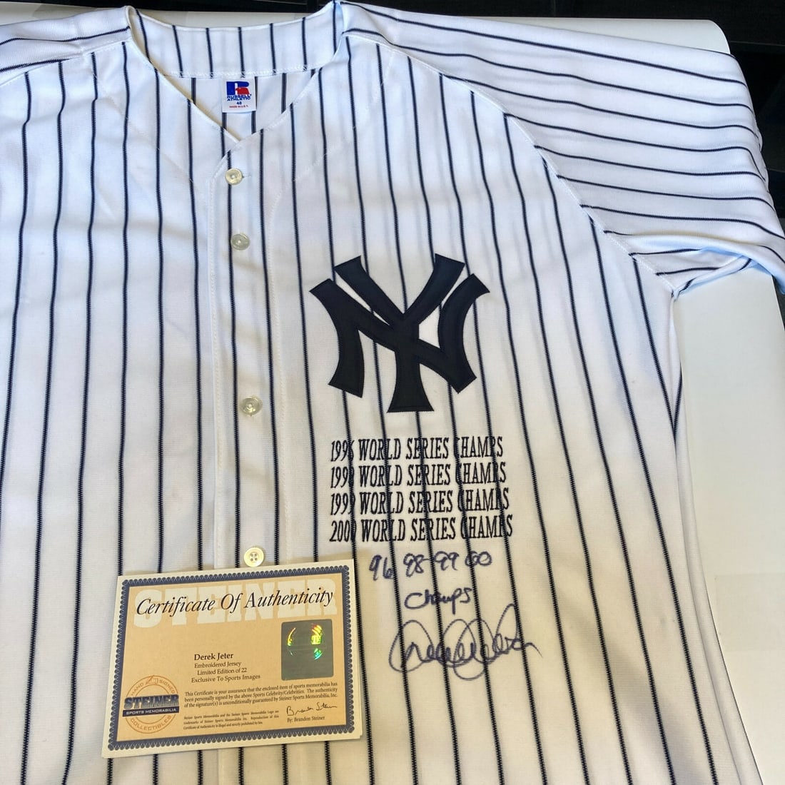 Derek Jeter Signed Yankees Jersey Inscribed 1996 1998 1999 2000 Champs Steiner COA Limited Edition: Derek Jeter Signed Yankees Jersey Inscribed 1996 1998 1999 2000 Champs Steiner COA Limited Edition Celebrate the legacy of baseball legend Derek Jeter with this signed and inscribed New York Yankees j