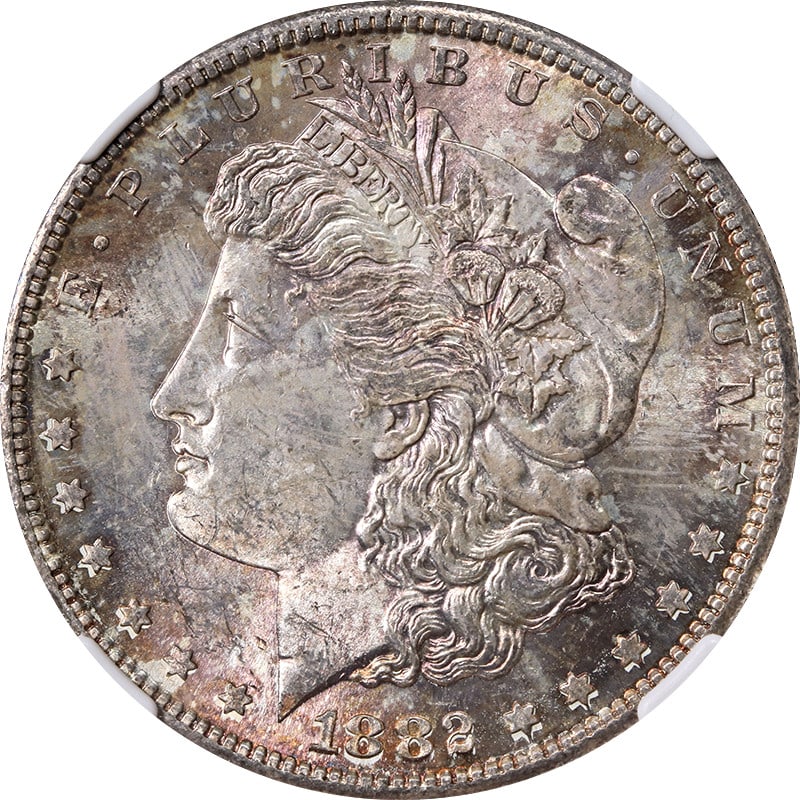 NGC MS63 1882 San Francisco Morgan Silver Dollar with Toning: NGC MS63 1882 San Francisco Morgan Silver Dollar with Toning This 1882-S Morgan Silver Dollar is certified by NGC with a grade of MS63. The coin is composed of silver with a fineness of 0.9 and was mi