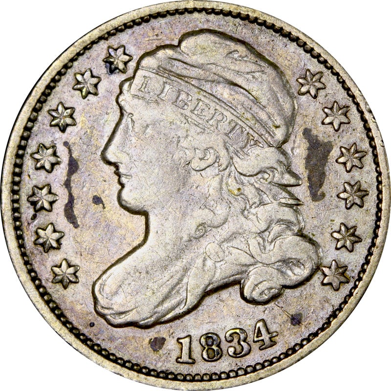 1834 United States Silver Dime Capped Bust Type: 1834 United States Silver Dime Capped Bust Type This 1834 Bust Dime is a circulated United States coin composed of silver with a fineness of 0.9. The coin is uncertified and in pre-owned condition. Sp