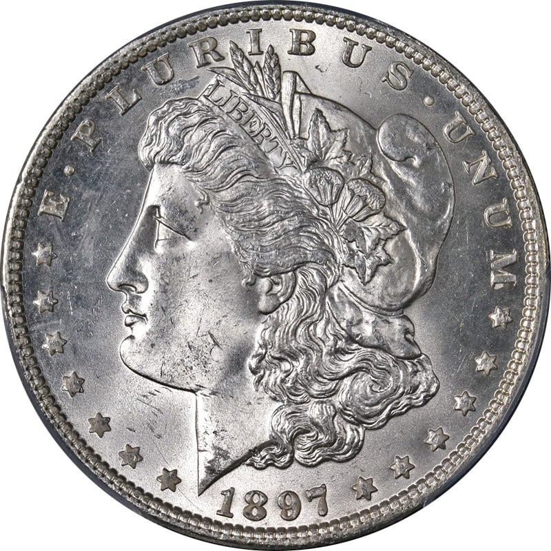 PCGS MS64 1897 Morgan Dollar Philadelphia Mint Blast White Silver Coin: PCGS MS64 1897 Morgan Dollar Philadelphia Mint Blast White Silver Coin This 1897-P Morgan Silver Dollar is certified by PCGS with a grade of MS64. It is uncirculated and features a strong strike with 