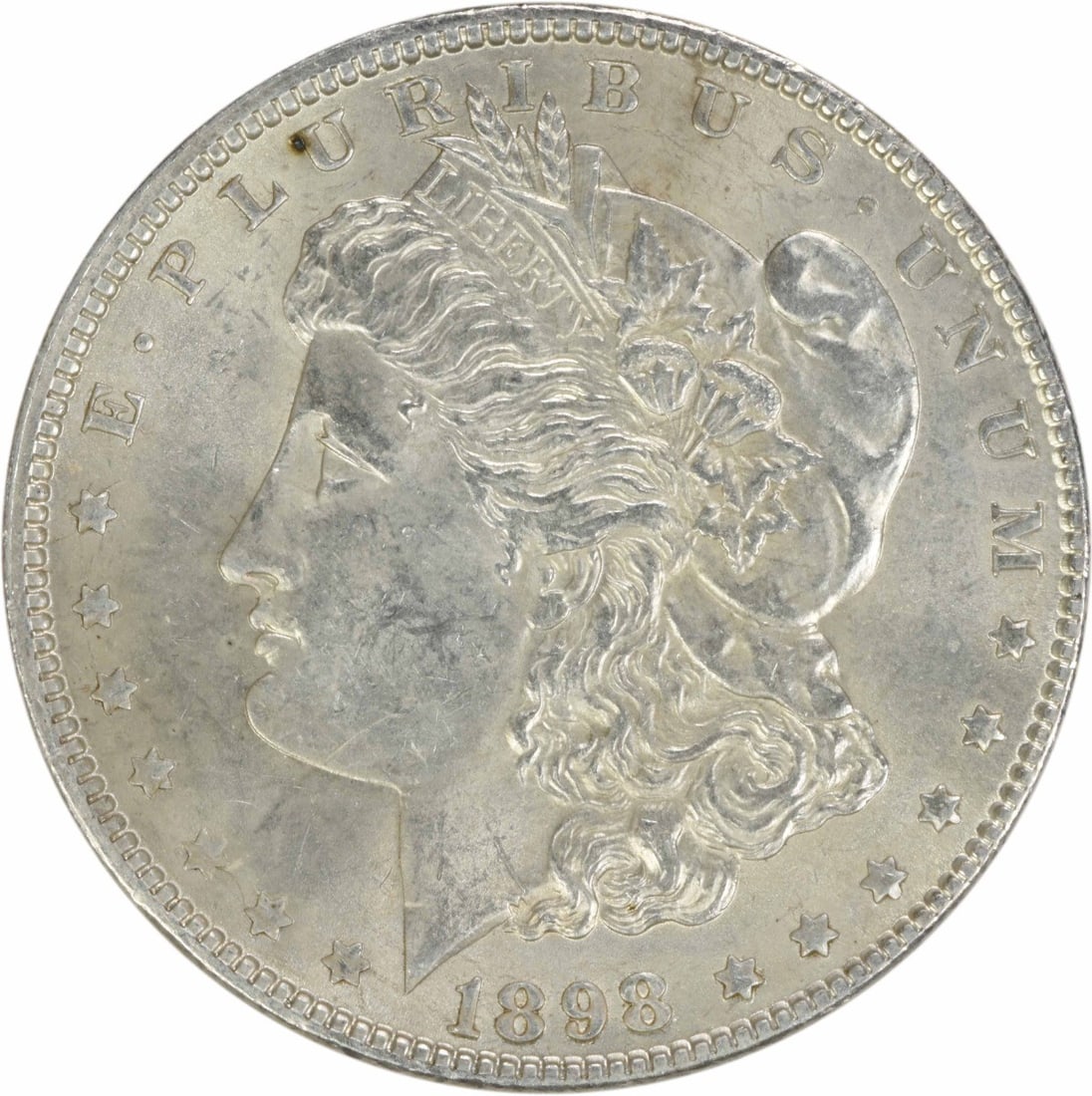 1898 Morgan Silver Dollar AU Uncertified 90% Silver Coin: 1898 Morgan Silver Dollar AU Uncertified 90% Silver Coin This 1898 Morgan Silver Dollar is a stunning piece of American history, featuring the iconic design by George T. Morgan. The coin, with a grade
