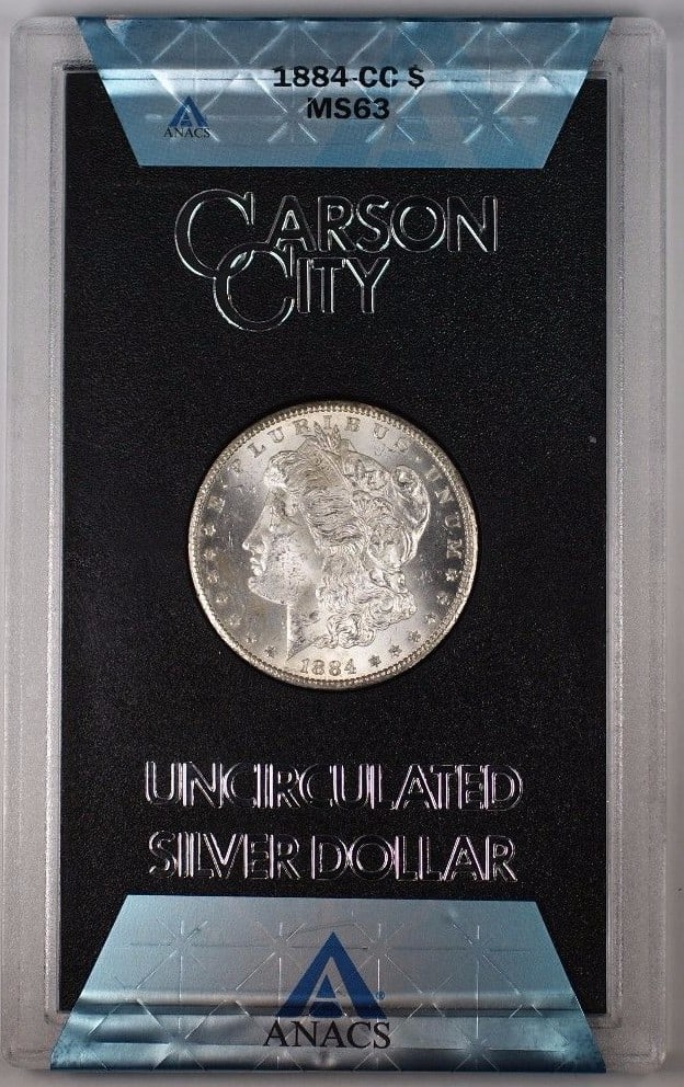 1884 Carson City Morgan Dollar GSA Hoard ANACS MS63 with Box and COA: 1884 Carson City Morgan Dollar GSA Hoard ANACS MS63 with Box and COA This 1884-CC Morgan Silver Dollar is part of the GSA Hoard and comes graded MS-63 by ANACS. Struck at the Carson City Mint and comp