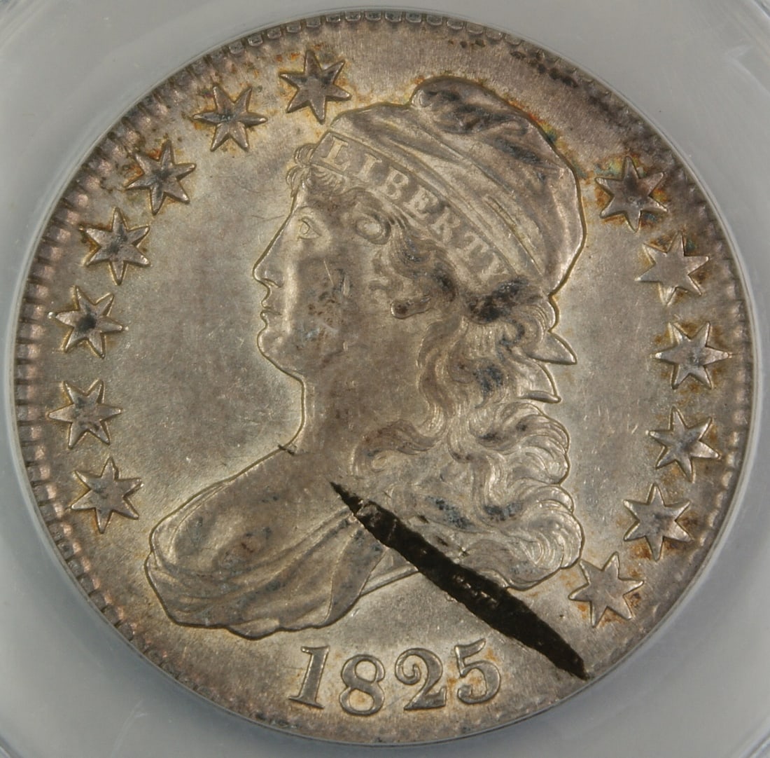 Capped Bust 1825 Silver Half Dollar ANACS AU-55 Planchet Streak Obverse: Capped Bust 1825 Silver Half Dollar ANACS AU-55 Planchet Streak Obverse This is an 1825 Capped Bust Silver Half Dollar graded AU-55 Details by ANACS. The coin features an obverse planchet streak and w