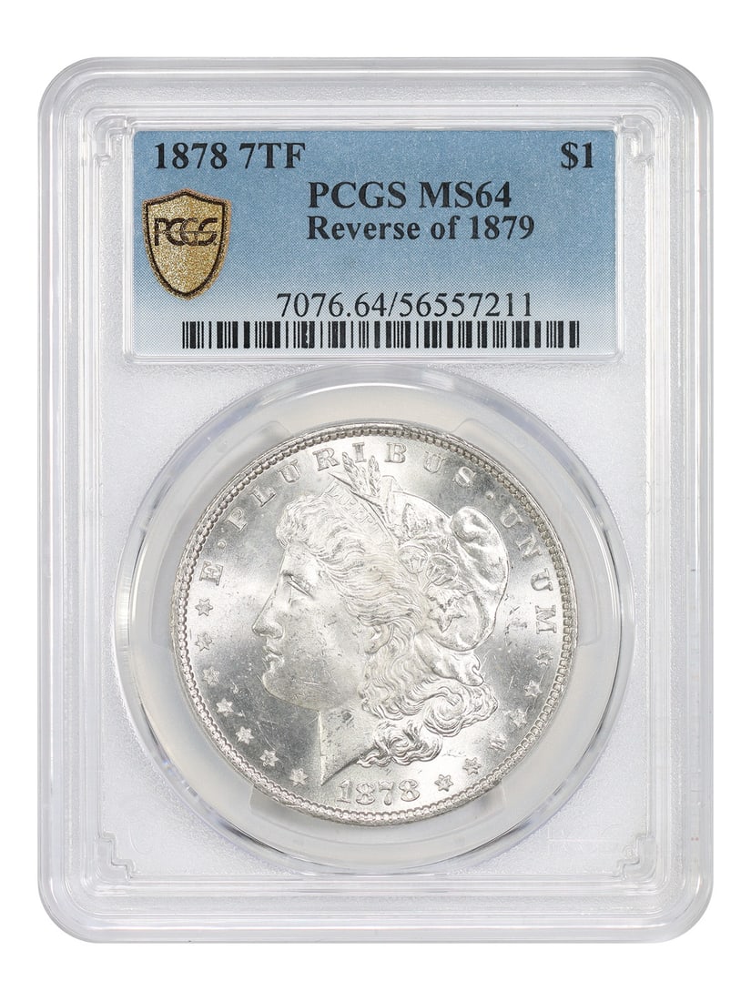 PCGS MS64 1878 Morgan Dollar 7 Tail Feathers Reverse of 1879 $1 Coin: PCGS MS64 1878 Morgan Dollar 7 Tail Feathers Reverse of 1879 $1 Coin This is an 1878 Morgan Dollar featuring the 7 Tail Feathers (7TF) variety, with the Reverse of 1879. The coin is graded MS64 by PCG