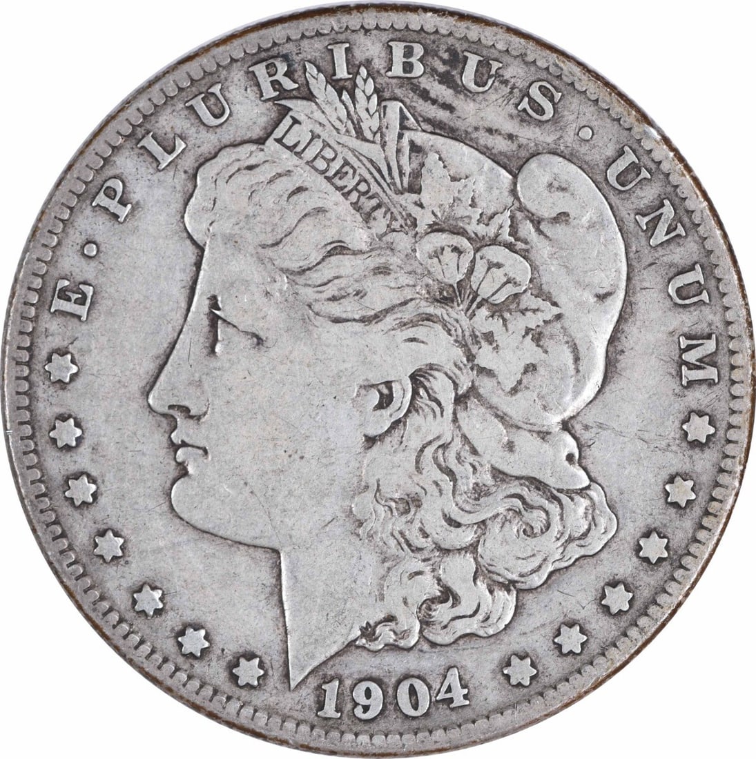 1904-S Morgan Silver Dollar VF Uncertified 90% Silver San Francisco: 1904-S Morgan Silver Dollar VF Uncertified 90% Silver San Francisco This 1904-S Morgan Silver Dollar showcases a vintage design by George T. Morgan, reflecting a rich history and craftsmanship. Struck