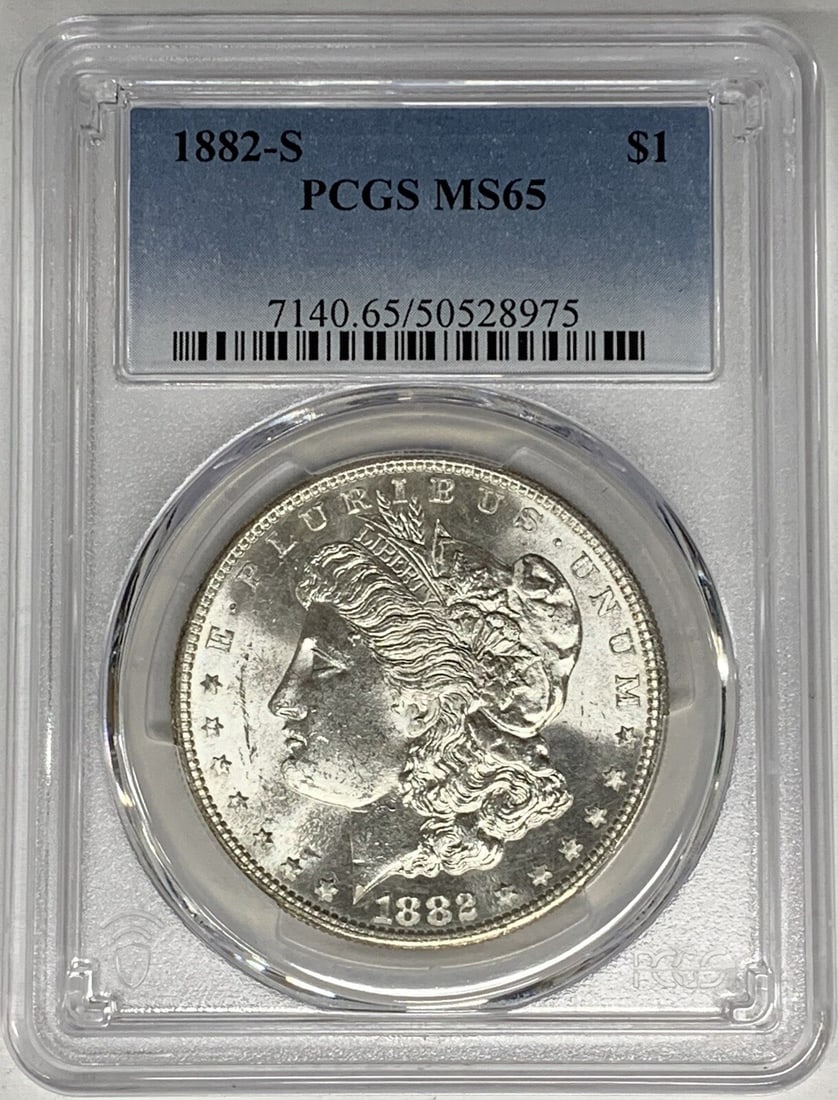 PCGS MS 65 Graded 1882-S Morgan Silver Dollar Uncirculated: PCGS MS 65 Graded 1882-S Morgan Silver Dollar Uncirculated This is an 1882-S Morgan Silver Dollar graded MS 65 by PCGS. The coin is uncirculated and composed of silver, originating from the United Sta