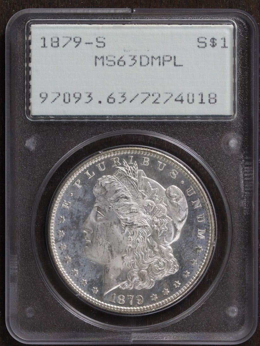 PCGS MS63 DMPL 1879 San Francisco Morgan Dollar in Rattler Holder: PCGS MS63 DMPL 1879 San Francisco Morgan Dollar in Rattler Holder This is an un-used 1879-S Morgan Silver Dollar graded MS63 Deep Mirror Prooflike (DMPL) by PCGS. Minted in San Francisco, this $1 coin