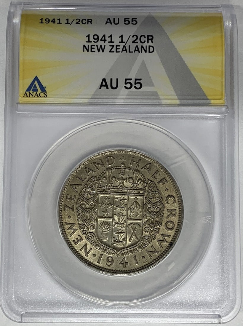 1941 Silver 1/2 Crown New Zealand Coin ANACS AU 55 Certified: 1941 Silver 1/2 Crown New Zealand Coin ANACS AU 55 Certified This is a 1941 New Zealand 1/2 Crown coin composed of silver. The coin has been certified and graded AU 55 by ANACS, indicating it is in Ab