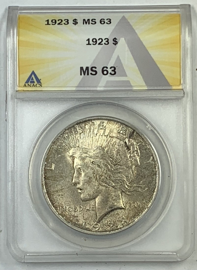 ANACS MS 63 Certified 1923 Peace Silver Dollar Uncirculated Coin: ANACS MS 63 Certified 1923 Peace Silver Dollar Uncirculated Coin This is a 1923 Peace silver $1 dollar coin from the United States, certified by ANACS with a grade of MS 63. The coin is composed of si