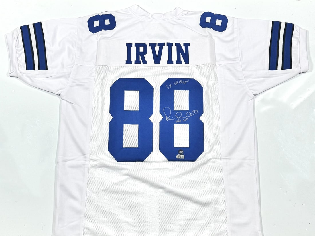Michael Irvin Autographed Dallas Cowboys Jersey with 2 Inscriptions Beckett Authenticated: Michael Irvin Autographed Dallas Cowboys Jersey with 2 Inscriptions Beckett Authenticated This is a pre-owned white pro style jersey autographed by Michael Irvin, featuring two inscriptions. The jerse
