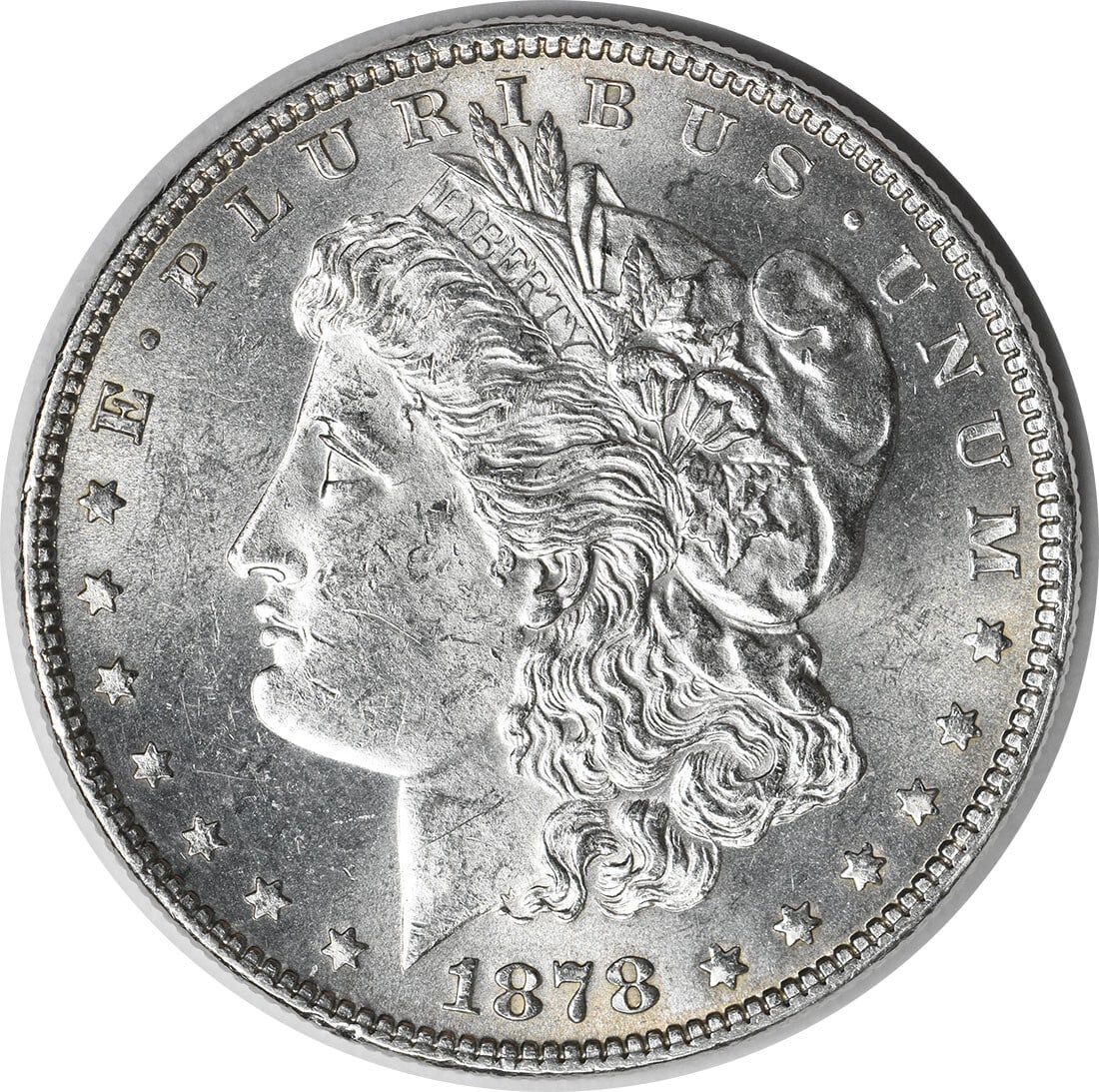 Morgan Dollar Silver Coin 1878 7 Tail Feathers Reverse Brilliant Uncirculated: Morgan Dollar Silver Coin 1878 7 Tail Feathers Reverse Brilliant Uncirculated This is a 1878 Morgan Silver Dollar featuring the 7 Tail Feathers Reverse of 1878. The coin is in brilliant uncirculated (