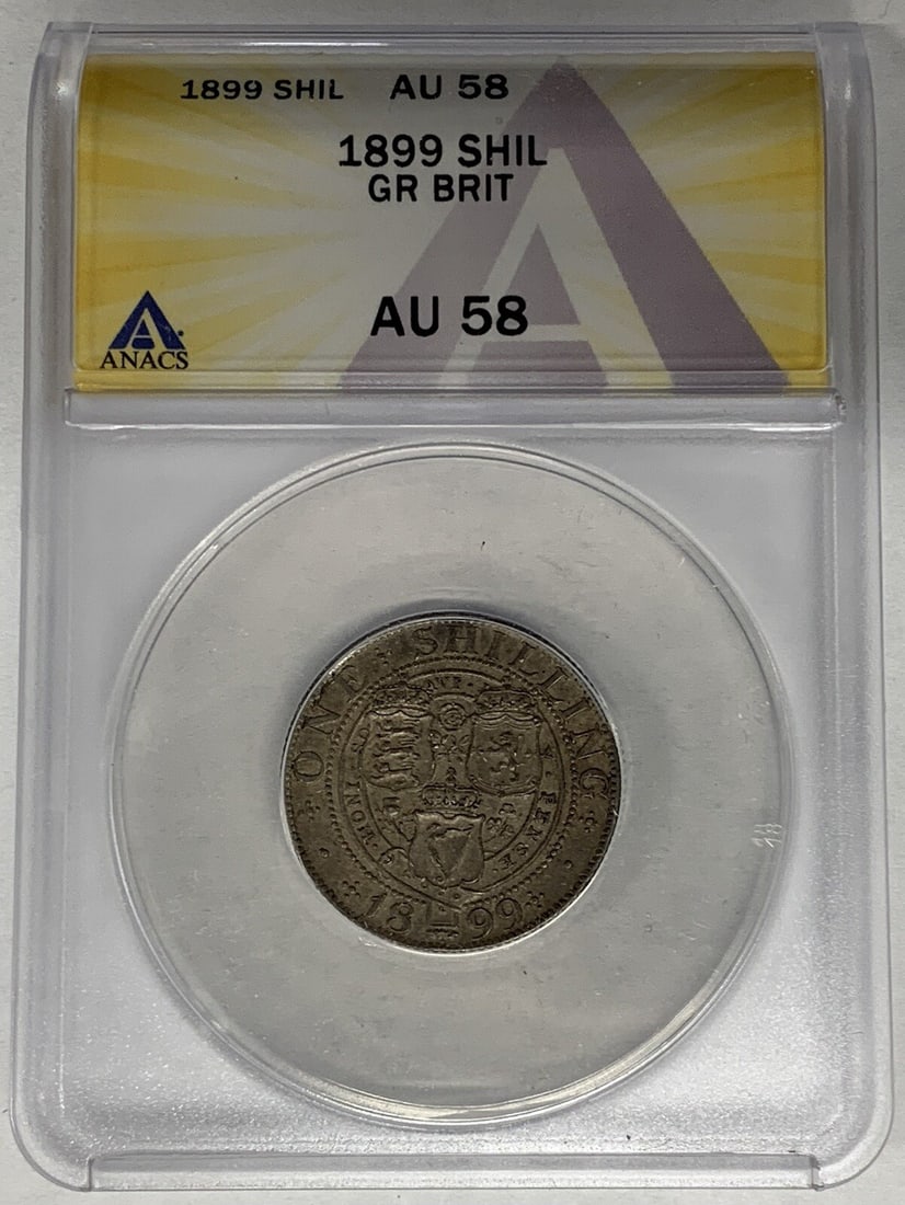 1899 Silver Shilling from United Kingdom Graded ANACS AU 58: 1899 Silver Shilling from United Kingdom Graded ANACS AU 58 This is an 1899 Great Britain 1 Shilling coin, certified by ANACS with a grade of AU 58. The coin is composed of silver and originates from 