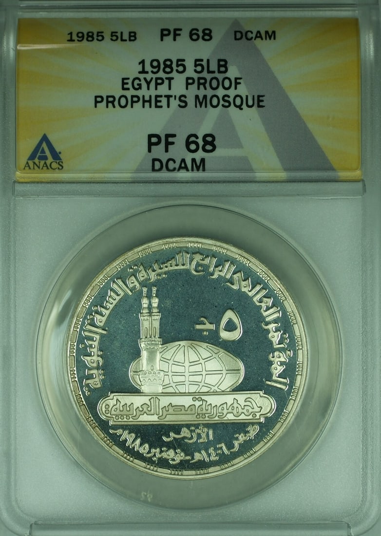 Egypt 1985 Proof Silver 5 Pounds Prophets Mosque ANACS PF-68 DCAM Coin: Egypt 1985 Proof Silver 5 Pounds Prophets Mosque ANACS PF-68 DCAM Coin This 1985 Egypt 5 Pounds proof coin commemorates the Prophet's Mosque and is crafted from silver. Graded by ANACS as PF-68 DCAM, 