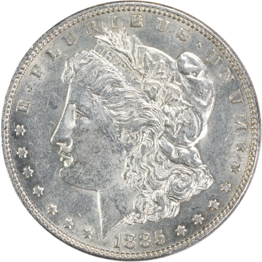 1885 Morgan Silver Dollar AU Uncertified 90% Silver Coin: 1885 Morgan Silver Dollar AU Uncertified 90% Silver Coin This 1885 Morgan Silver Dollar features a beautiful design by George T. Morgan, showcasing the iconic Liberty head on the obverse and an eagle 