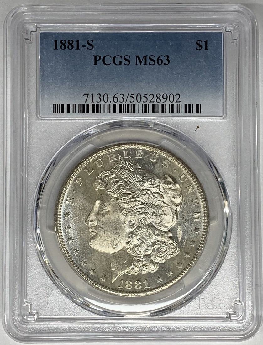 PCGS MS 63 1881-S Morgan Silver Dollar Proof-Like Obverse: PCGS MS 63 1881-S Morgan Silver Dollar Proof-Like Obverse This is an 1881-S Morgan Silver Dollar with a proof-like obverse. The coin is uncirculated and graded MS 63 by PCGS. It is composed of silver 