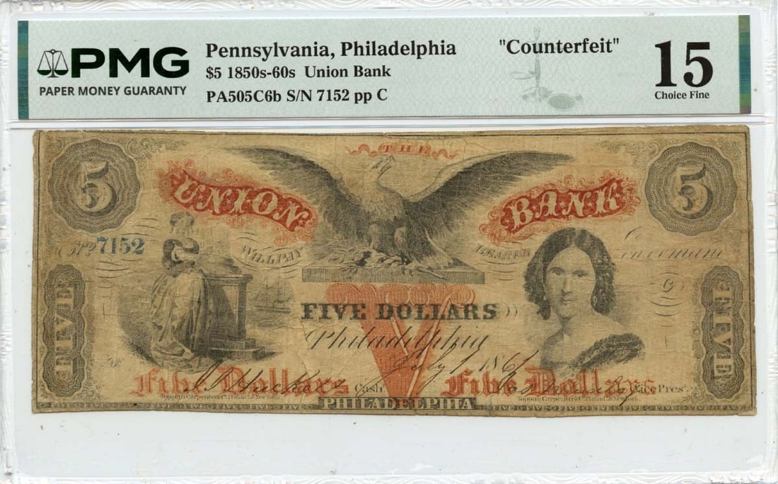Counterfeit 1861 Union Bank Philadelphia $5 Note Certified by PMG F15: Counterfeit 1861 Union Bank Philadelphia $5 Note Certified by PMG F15 This is an 1861 $5 obsolete note from the Union Bank in Philadelphia, Pennsylvania, identified as a counterfeit. The note has been
