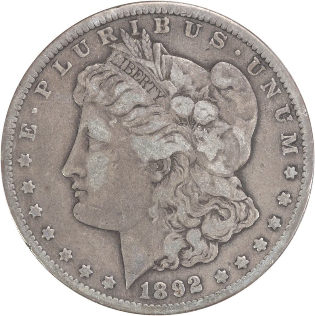 1892-CC Morgan Silver Dollar F Uncertified 90% Silver Coin: 1892-CC Morgan Silver Dollar F Uncertified 90% Silver Coin This 1892-CC Morgan Silver Dollar is a remarkable collectible piece from the Carson City Mint. It features a classic design by George T. Morg