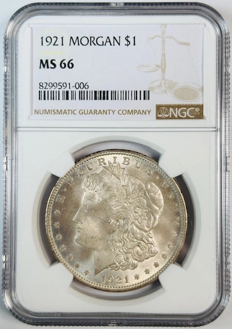 NGC MS66 1921 Silver Dollar Coin United States Uncirculated: NGC MS66 1921 Silver Dollar Coin United States Uncirculated This 1921 Morgan Silver Dollar is certified by NGC with a grade of MS 66, indicating an uncirculated coin in excellent pre-owned condition. 