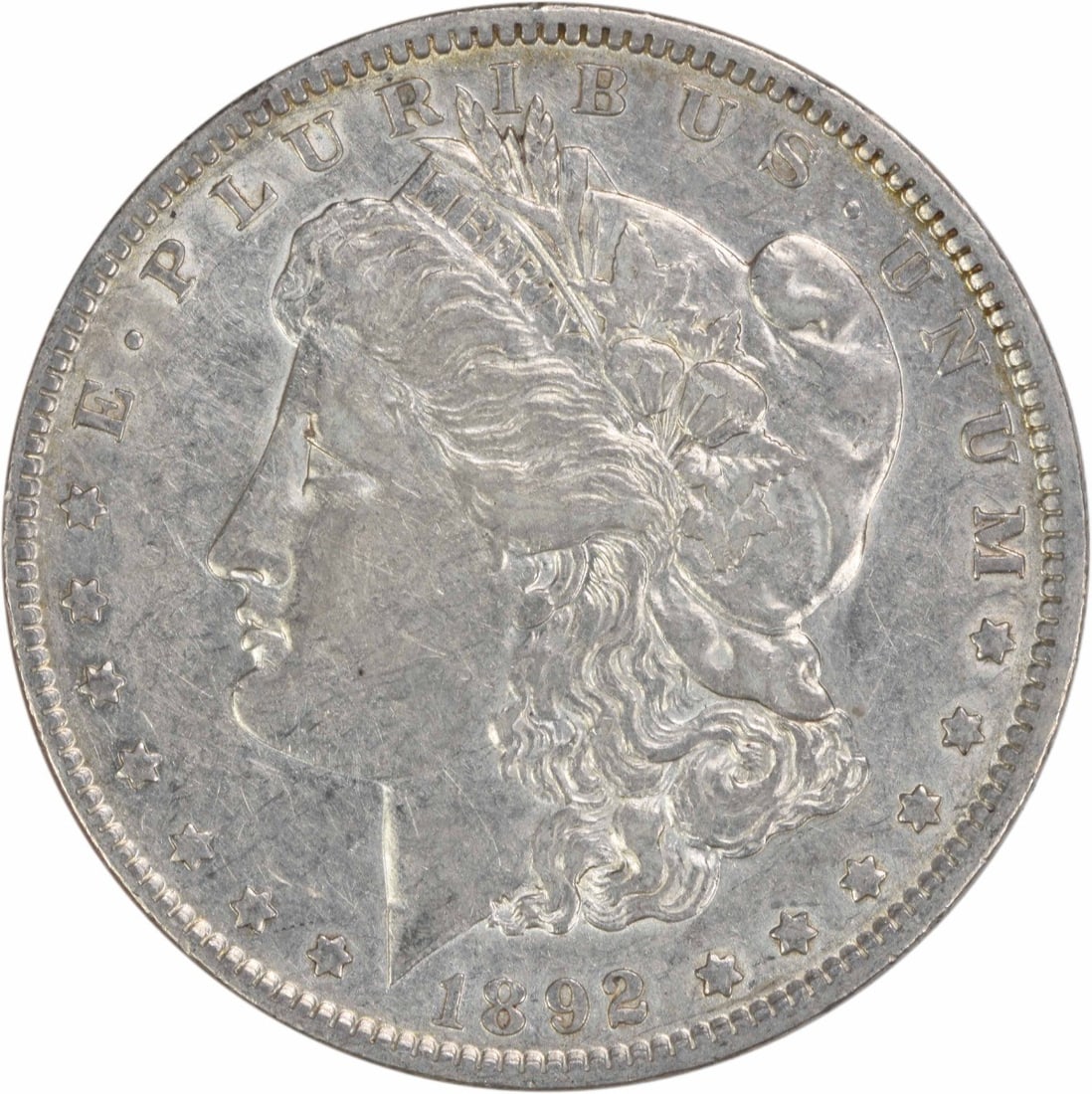 1892 Morgan Dollar Philadelphia EF Grade 90 Percent Silver Uncertified Coin: 1892 Morgan Dollar Philadelphia EF Grade 90 Percent Silver Uncertified Coin This is an 1892 Morgan Silver Dollar coin from the United States, designed by George T. Morgan. The coin is circulated, grad