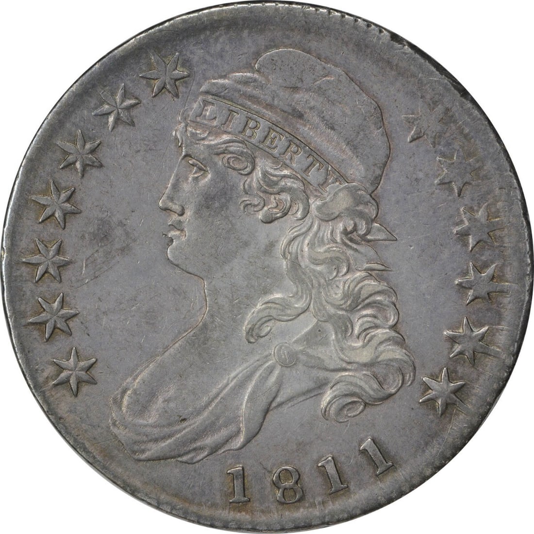 1811 Bust Half Dollar AU John Reich Philadelphia Mint 50C: 1811 Bust Half Dollar AU John Reich Philadelphia Mint 50C This 1811 Bust Half Dollar is an exquisite piece of American numismatic history. Struck in Philadelphia, this coin features a composition of 8