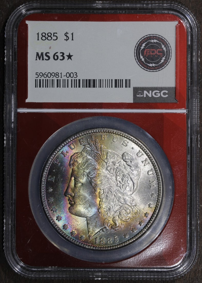 NGC MS63 Star 1885 Morgan Dollar Philadelphia Rainbow Toned Silver Coin: NGC MS63 Star 1885 Morgan Dollar Philadelphia Rainbow Toned Silver Coin This is an 1885 Morgan Silver Dollar graded MS63* by NGC. Featuring beautiful rainbow toning, this uncirculated coin was minted 