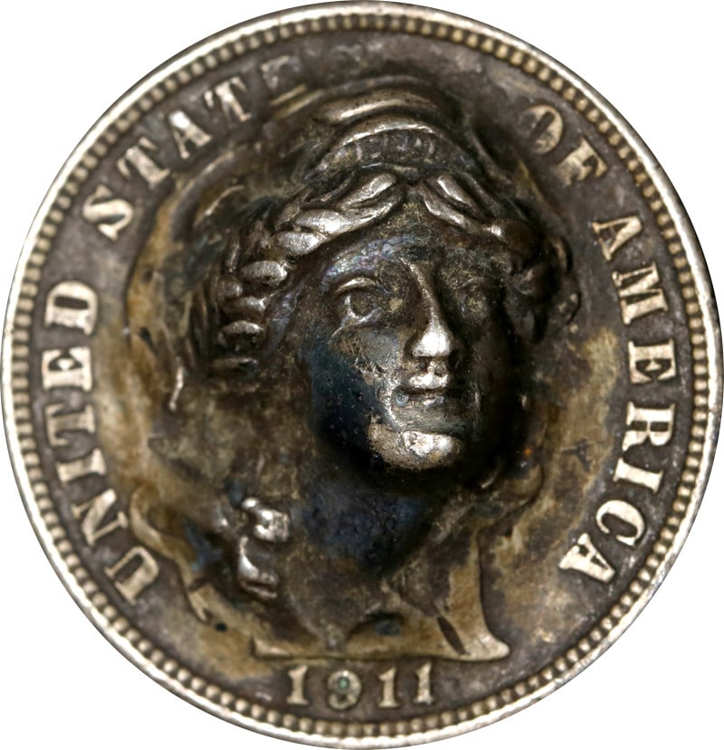 United States 1911 Silver Barber Dime Pop-Out Design Coin: United States 1911 Silver Barber Dime Pop-Out Design Coin This is a pre-owned 1911 Barber Dime featuring a pop-out design. The coin is composed of silver with a fineness of 0.9 and originates from the