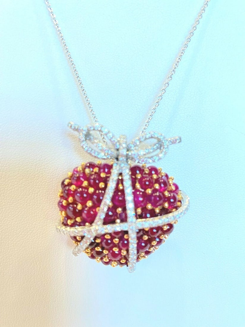 Oscar Heyman Platinum Ruby Diamond Brooch Necklace with Ribbon Design: Oscar Heyman Platinum Ruby Diamond Brooch Necklace with Ribbon Design Introducing a magnificent brooch by Oscar Heyman, expertly crafted in 950 platinum featuring stunning Berme rubies and diamonds. T