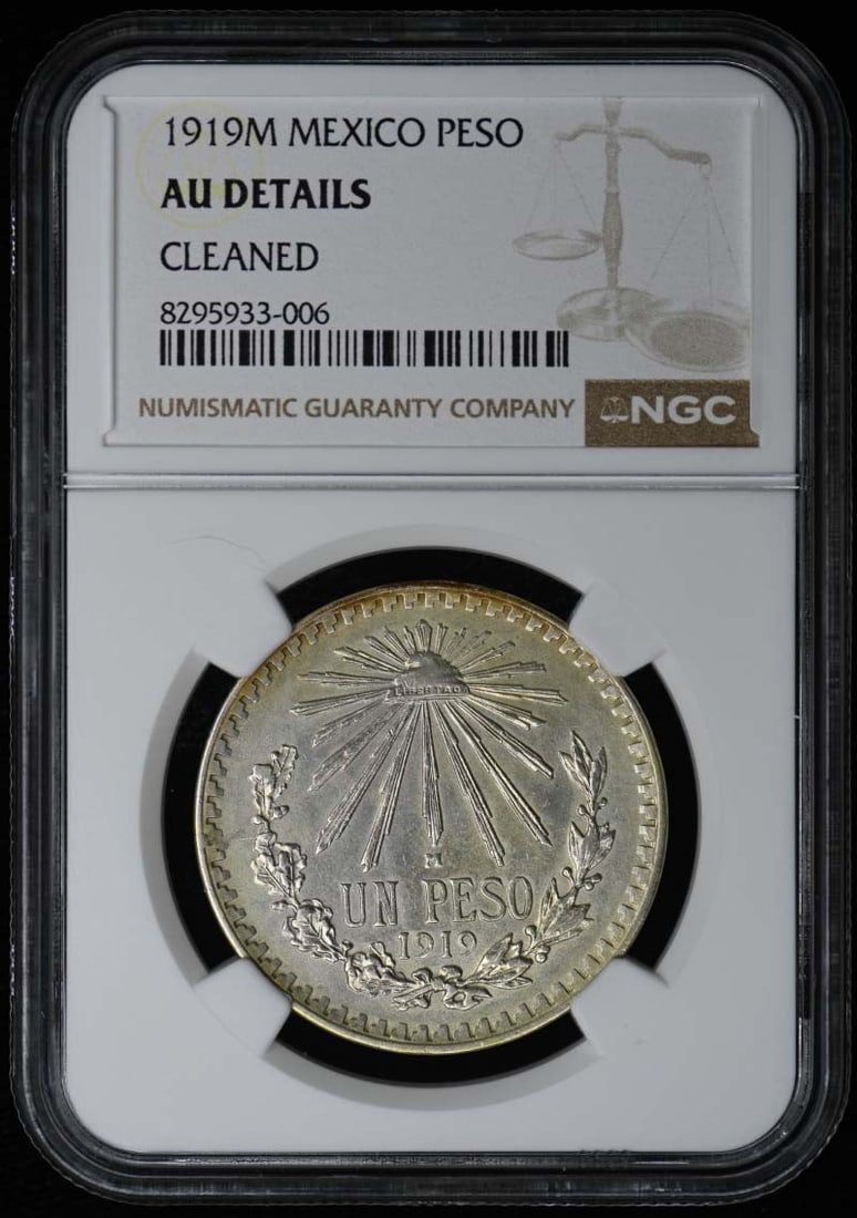 1919 Mexico One Peso NGC AU Details Certified Coin: 1919 Mexico One Peso NGC AU Details Certified Coin This 1919 Mexico One Peso coin, graded as AU Details by NGC, showcases its uncirculated condition, making it a remarkable addition for collectors. Wi