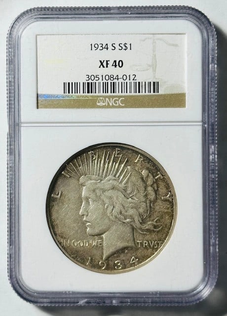 NGC Graded 1934 San Francisco Peace Silver Dollar XF 40: NGC Graded 1934 San Francisco Peace Silver Dollar XF 40 This is a 1934 S Peace Dollar certified by NGC with a grade of XF 40. Minted in San Francisco, this circulated silver dollar is an authentic pie