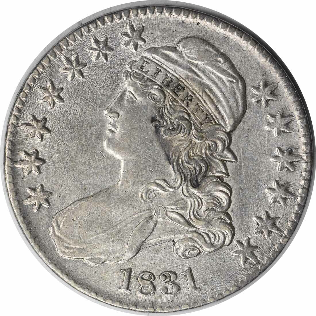 1831 Bust Half Dollar AU John Reich Design Uncertified: 1831 Bust Half Dollar AU John Reich Design Uncertified This 1831 Bust Half Dollar is a notable piece of American numismatic history. It features a design by John Reich and is composed of 89.2% silver 