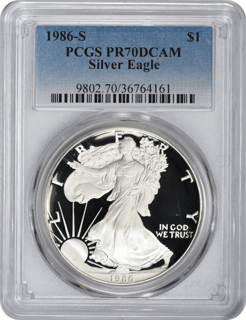 1986-S American Silver Eagle PR70DCAM PCGS Proof 1 oz Silver Coin: 1986-S American Silver Eagle PR70DCAM PCGS Proof 1 oz Silver Coin This stunning 1986-S American Silver Eagle is certified as PR70DCAM by PCGS, showcasing its exceptional quality. Struck by the U.S. Mi