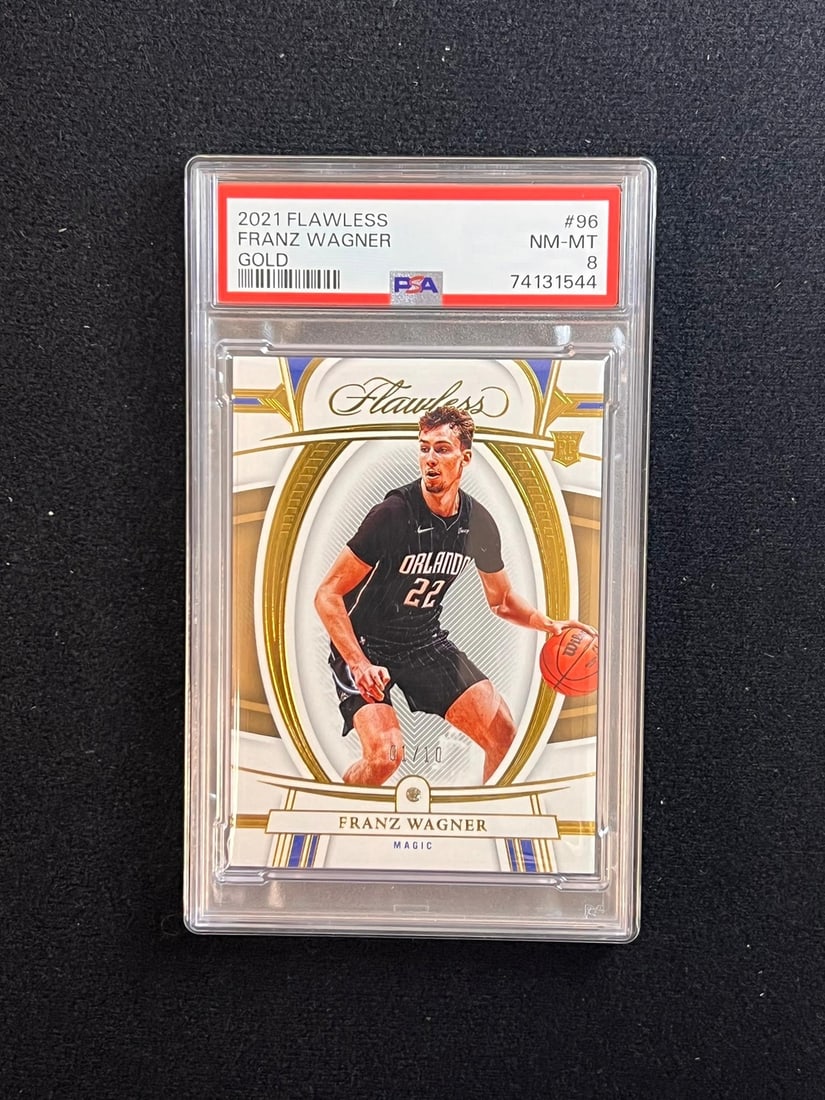2021-22 Panini Flawless Gold Franz Wagner Autographed RC PSA 8: 2021-22 Panini Flawless Gold Franz Wagner Autographed RC PSA 8 Presenting the 2021-22 Panini Flawless Gold #96 Franz Wagner trading card, a remarkable collectible for any basketball enthusiast. This c
